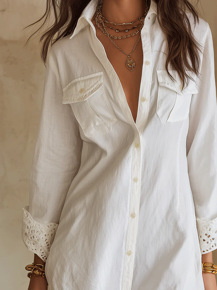 Effortless white button-front mini shirt dress, a chic long sleeve cover-up for resort, vacation, or boho summer style.