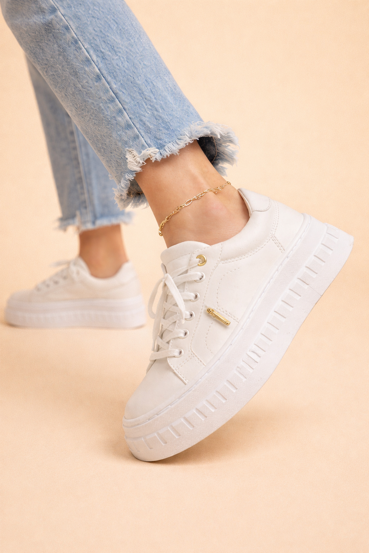 Trendy ladies' lace-up platform sneakers featuring a soft cushioned sole. Great for casual footwear & height-increasing fashion.