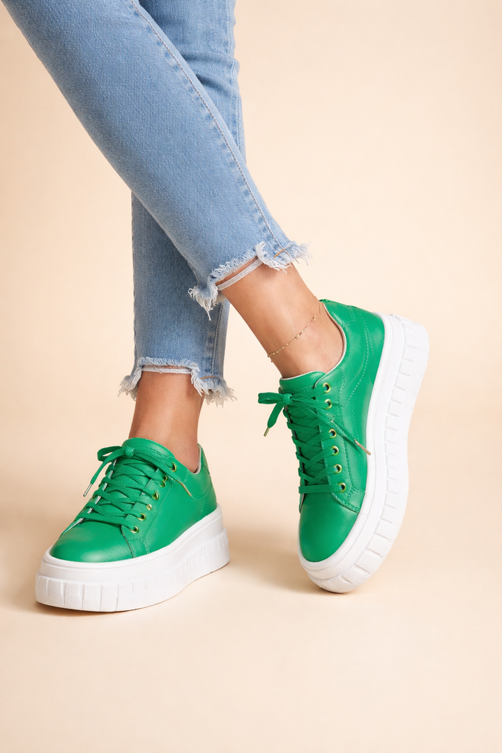 Modern women's platform sneakers in navy with a responsive cushioned sole. Chic lace-up for comfort & versatile height-increasing style.