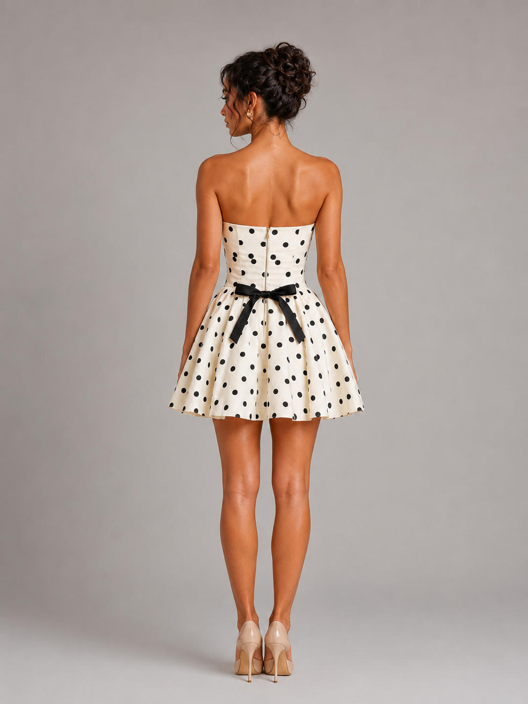 Playful retro strapless white polka dot mini skater dress with corset top, perfect for parties.