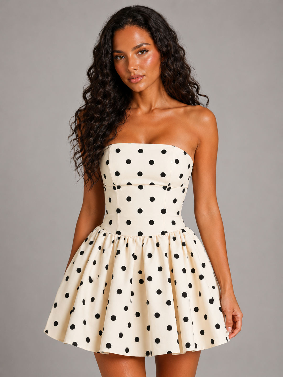Elegant women's white strapless polka dot mini dress with corset detail, ideal for homecoming dances.
