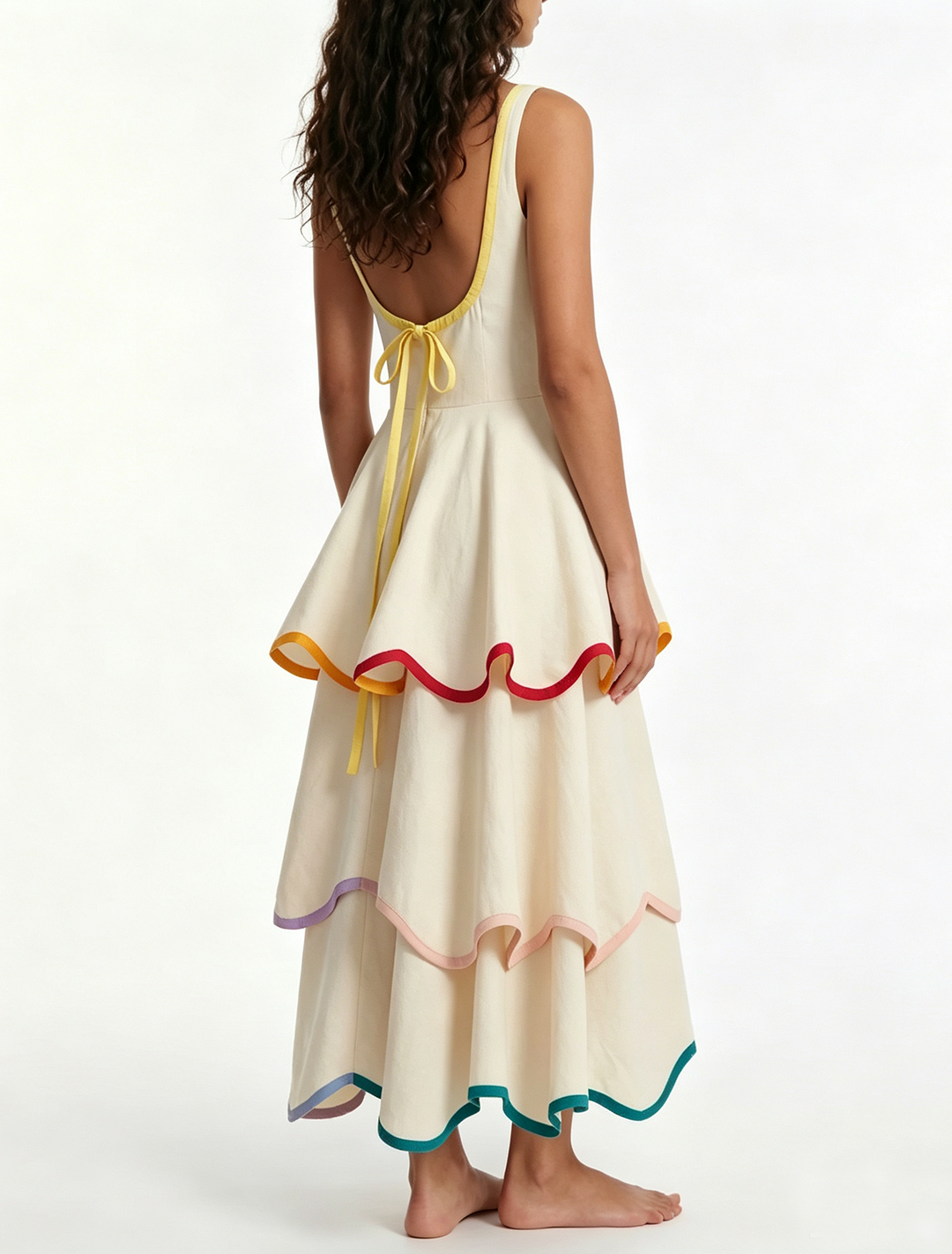 Elegant women's white tiered maxi dress with playful rainbow ruffles. Sleeveless design, great for any summer occasion.