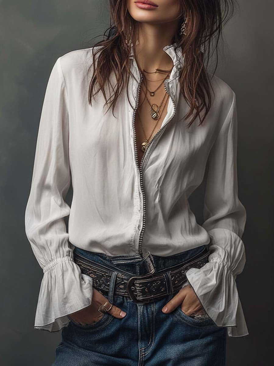 Women's white zip-front blouse with elegant bell cuffs and long sleeves. Perfect for office or casual wear.