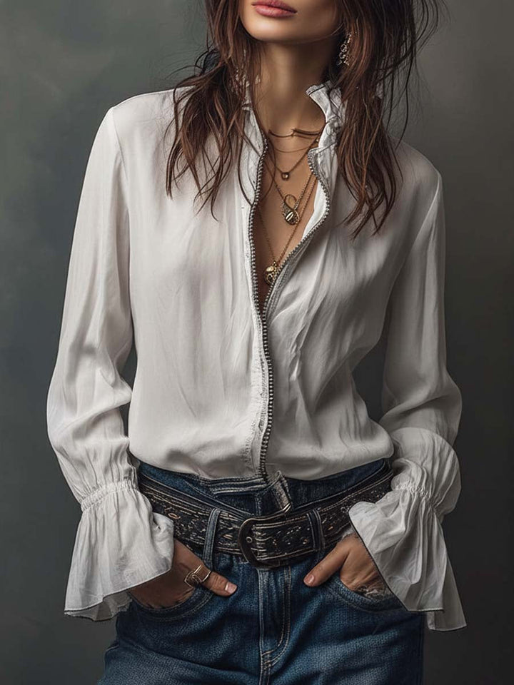 Women's white zip-front blouse with elegant bell cuffs and long sleeves. Perfect for office or casual wear.