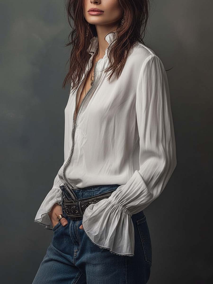 Stylish women's tailored white blouse featuring a zip front and fashionable bell cuffs. Versatile fashion piece.
