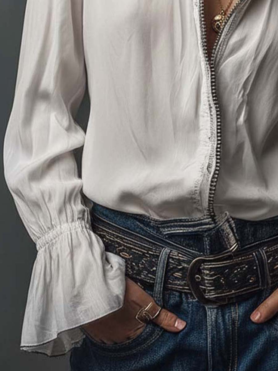 Tailored white blouse for women, designed with a practical zip front and trendy bell cuffs. Fashion-forward office wear.
