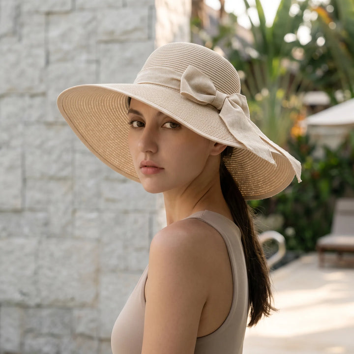 Women's wide brim foldable sun hat for UV protection, perfect for beach & travel.