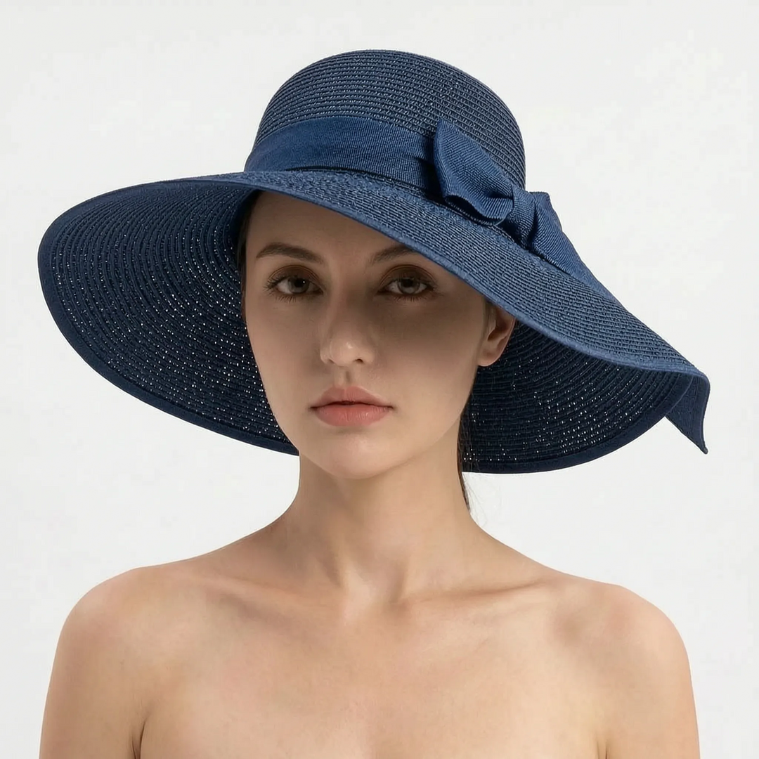 Versatile women's wide brim sun hat, foldable and chic for beach, travel, & everyday summer wear.