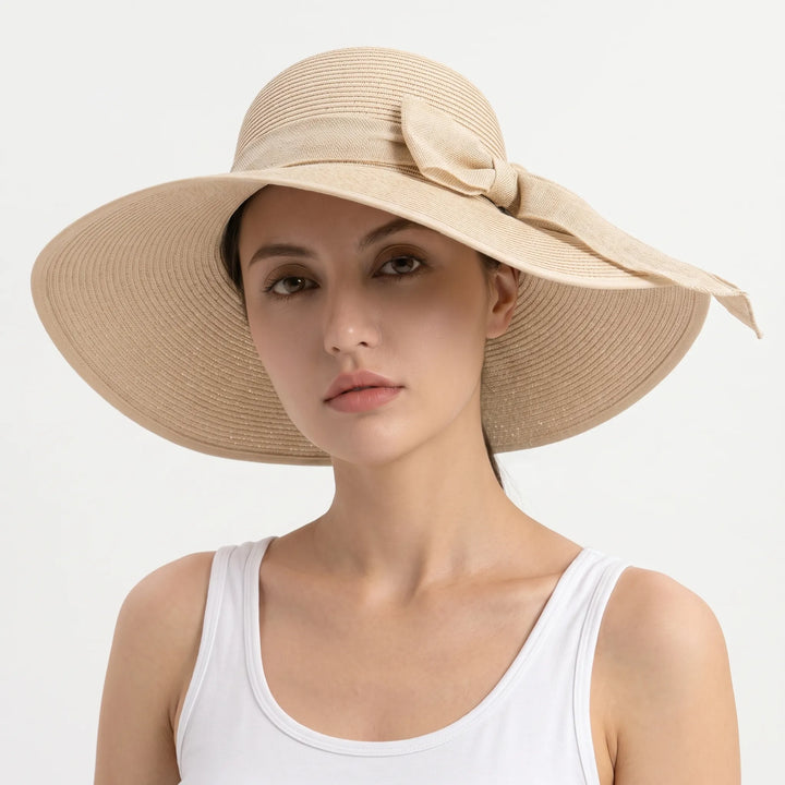 Foldable women's wide brim sun hat, easy to pack for travel & beach vacations.