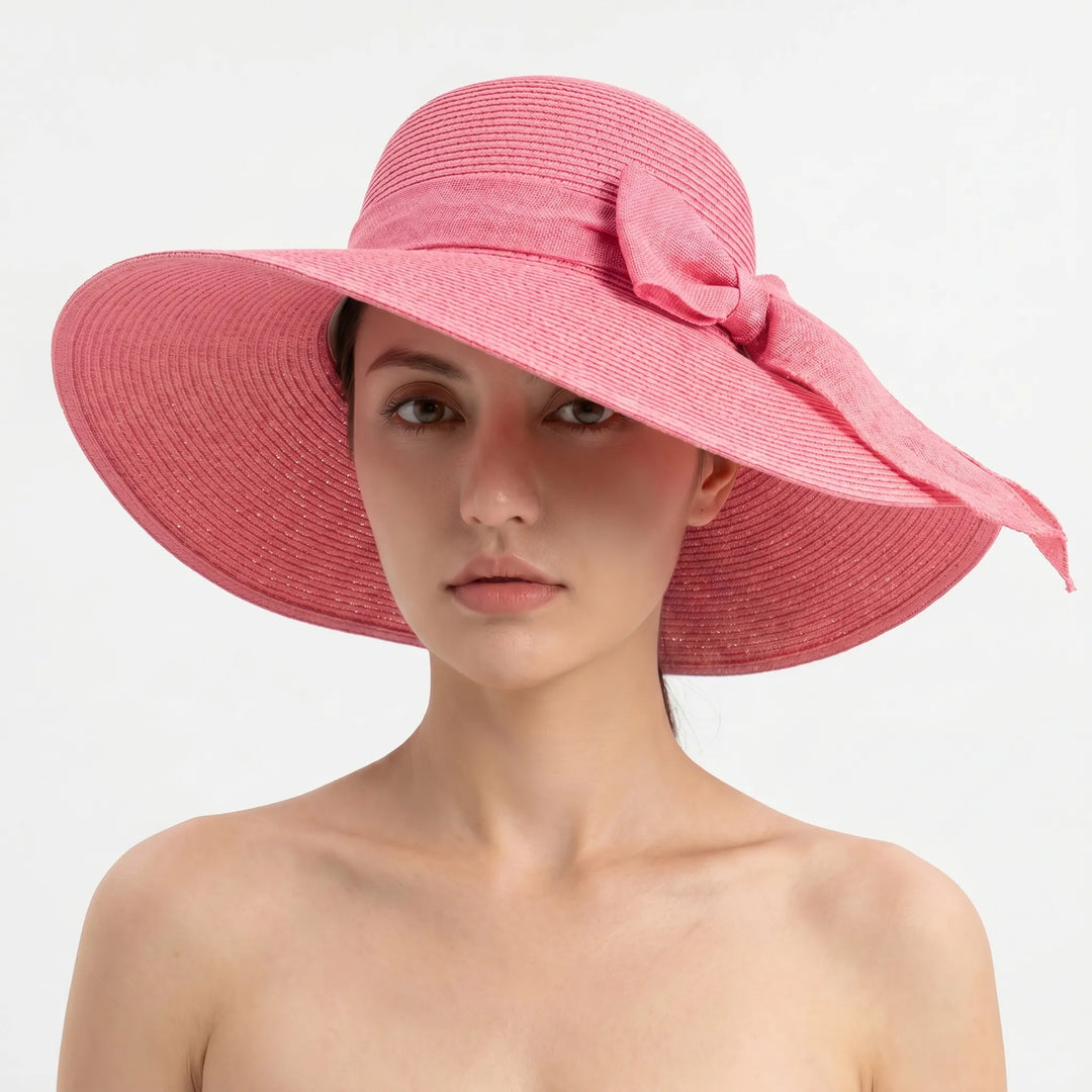 Travel-friendly women's wide brim sun hat, foldable design for easy packing & sun protection.