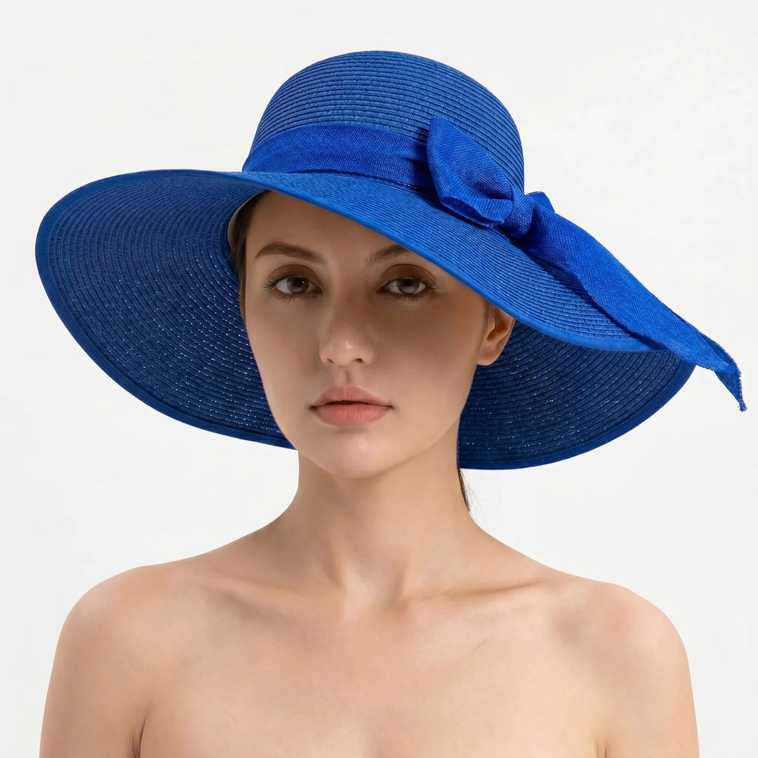 Elegant women's wide brim foldable sun hat, ideal for summer fashion, beach, & sun protection.
