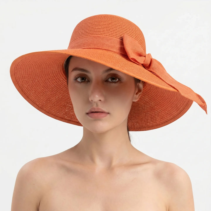 Summer women's wide brim sun hat, foldable for travel, offering great UV protection on sunny days.