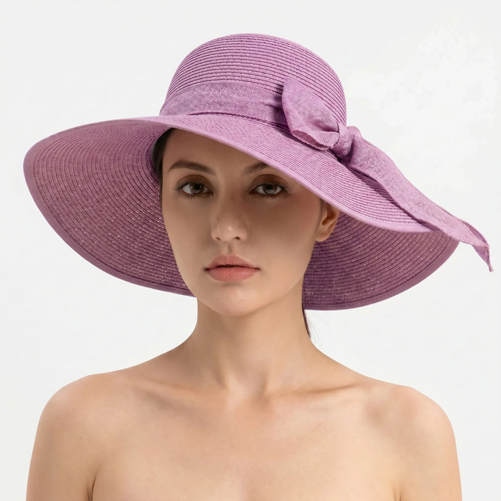 Lightweight, foldable women's wide brim sun hat, great for travel, beach, & UV protection.