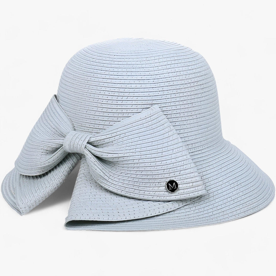 Women's wide brim Soléra sun hat for stylish UV protection, perfect for beach, travel, & summer fashion.