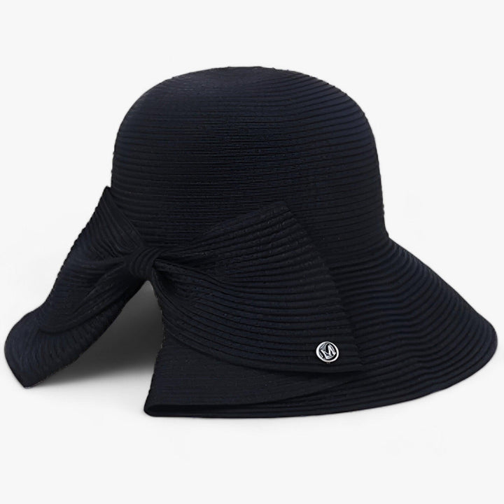 Fashionable women's wide brim sun hat with UV protection, ideal for summer outfits & outdoor adventures.