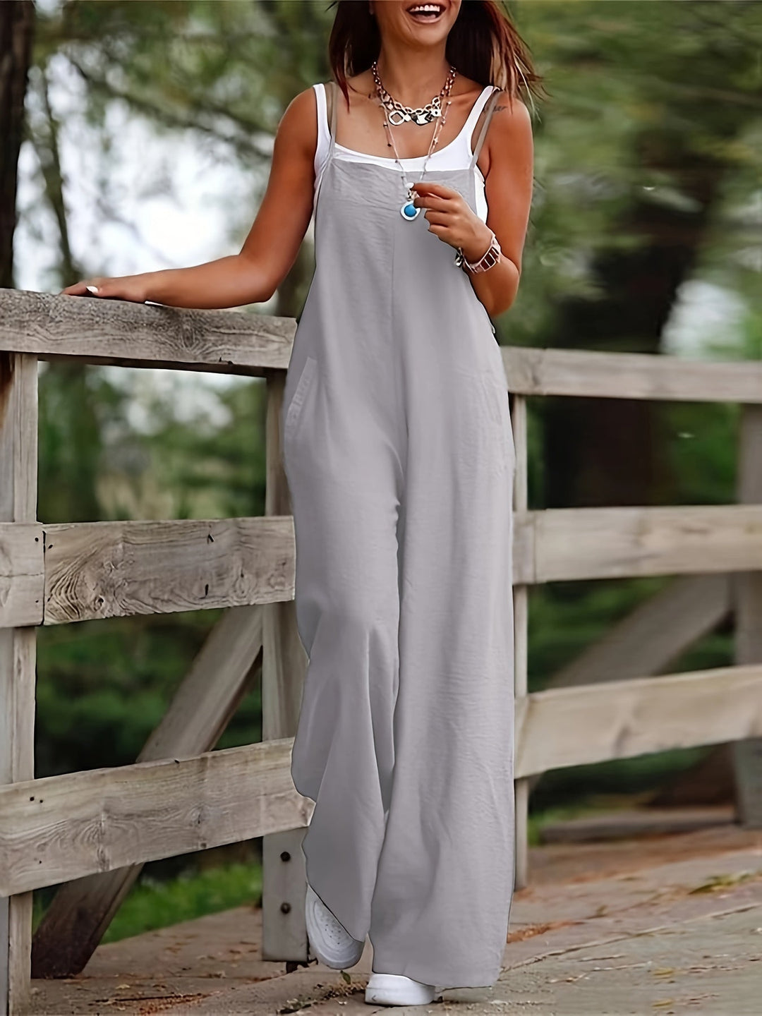Sleeveless wide leg jumpsuit with pockets, a versatile women's casual wear piece.
