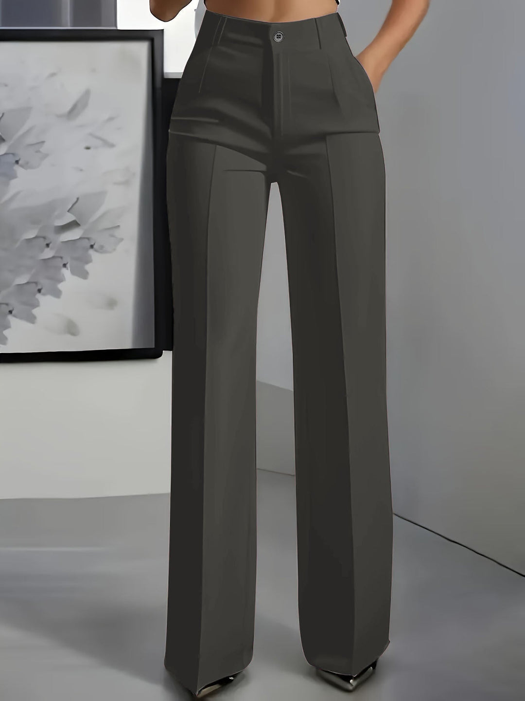 Elegant women's wide-leg high-waist trousers, structured for a sophisticated professional or stylish casual appearance.