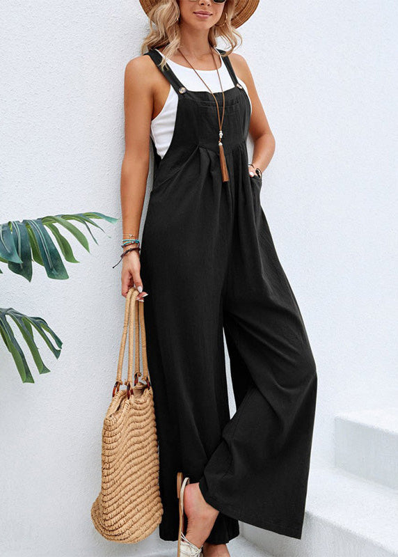 Flowy women's wide leg jumpsuit, designed with adjustable straps & functional pockets. Ultimate comfort for spring fashion.