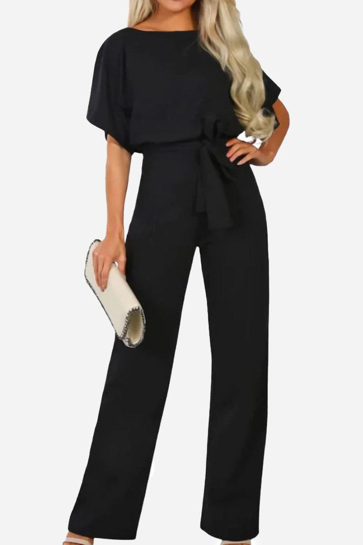 Women's wide-leg jumpsuit with batwing sleeves & matching belt. Elegant one-piece for versatile styling.