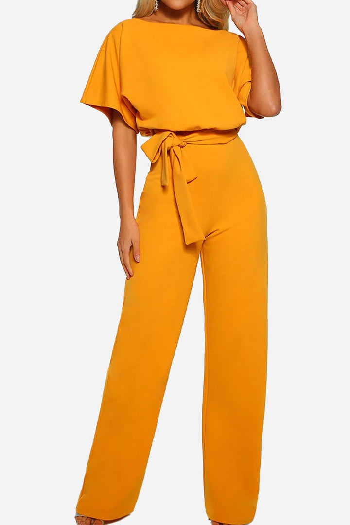 Comfortable women's wide-leg jumpsuit with batwing sleeves & belt. A versatile one-piece for casual chic.