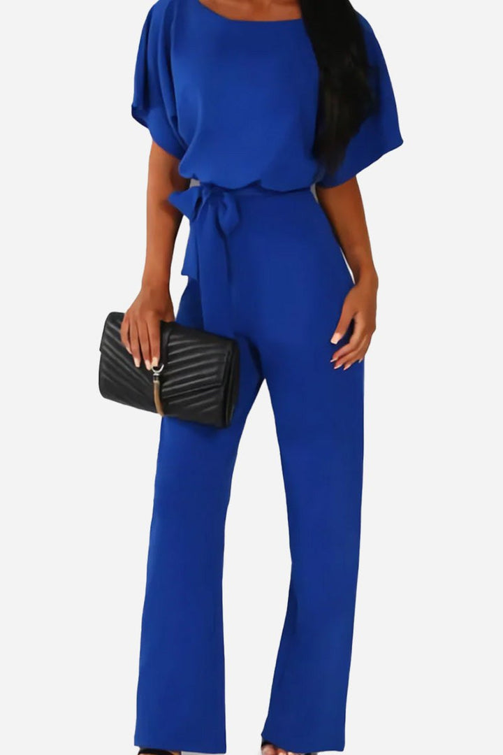 Fashionable women's wide-leg jumpsuit. Batwing sleeves and a flattering belt make this one-piece elegant.
