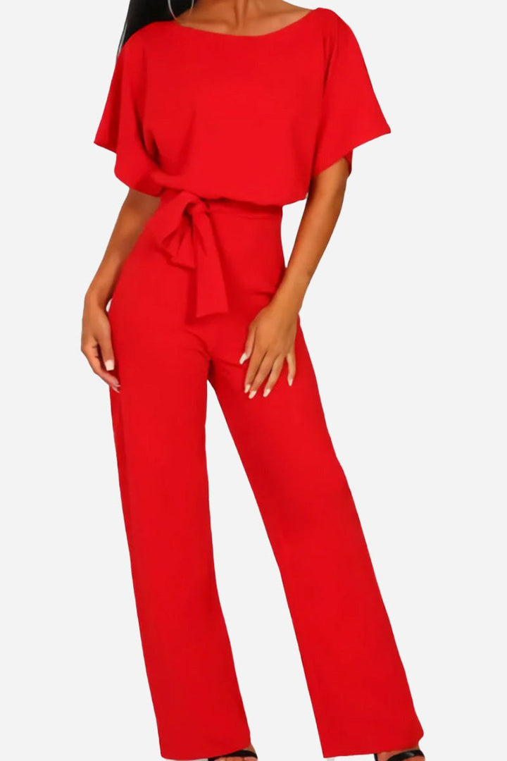 Stylish women's wide-leg jumpsuit with batwing sleeves and a tie belt. Ideal for summer and parties.