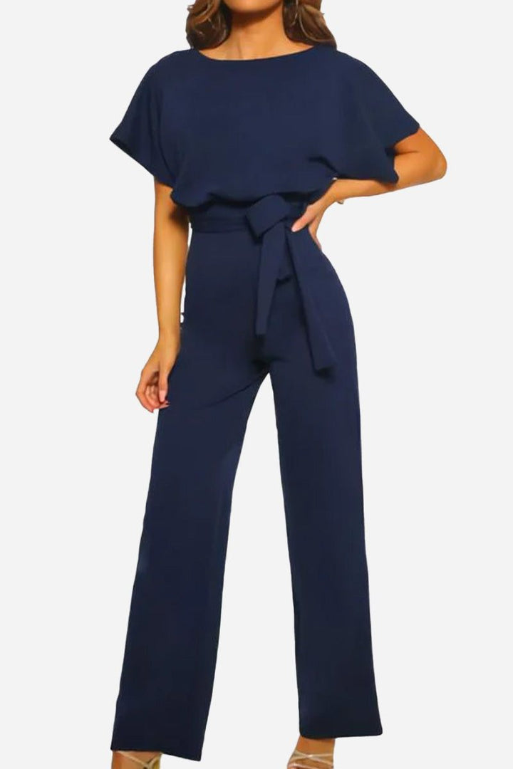 Elegant belted wide-leg jumpsuit for women, featuring flowy batwing sleeves. Day-to-night fashion.