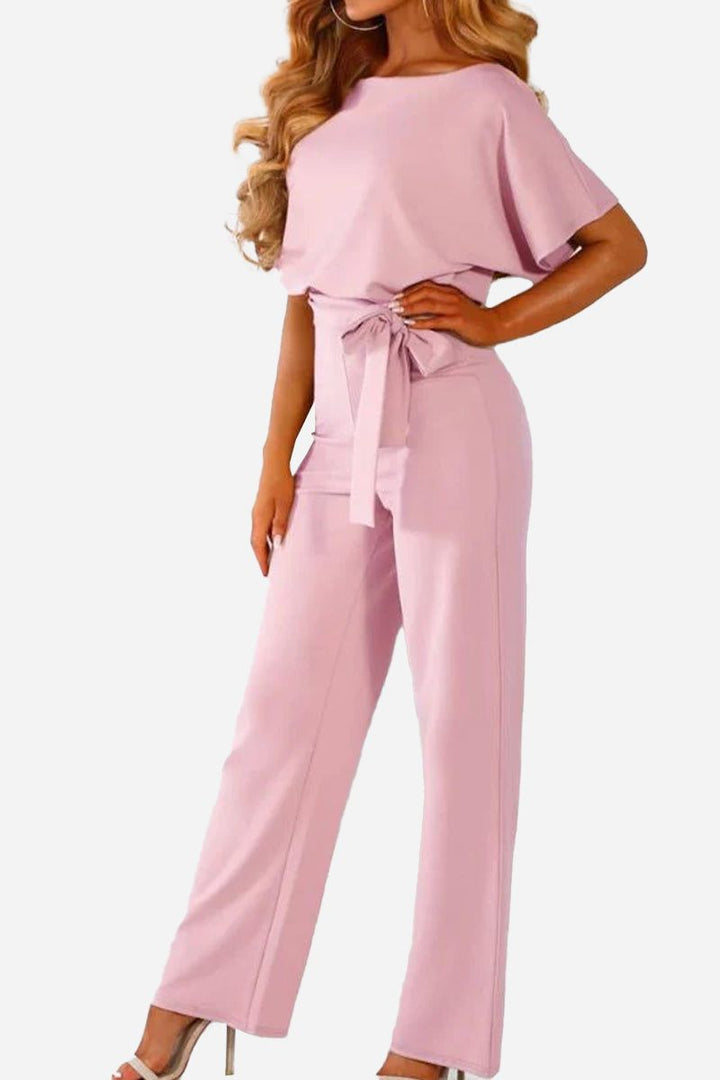 Versatile women's wide-leg jumpsuit. Batwing sleeves & belt offer a comfortable, chic one-piece style.