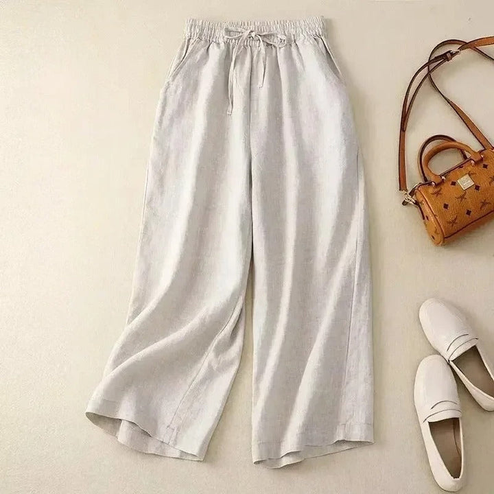 Close-up of women's relaxed fit wide-leg linen blend pants with an adjustable drawstring waist detail
