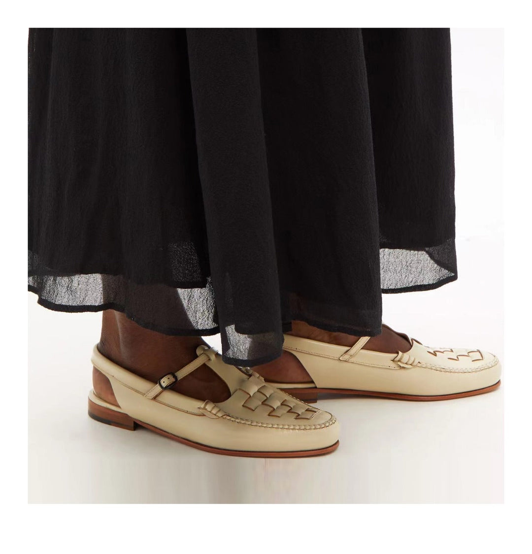Front view of women's comfortable leather slingback sandals with a beautifully woven finish.