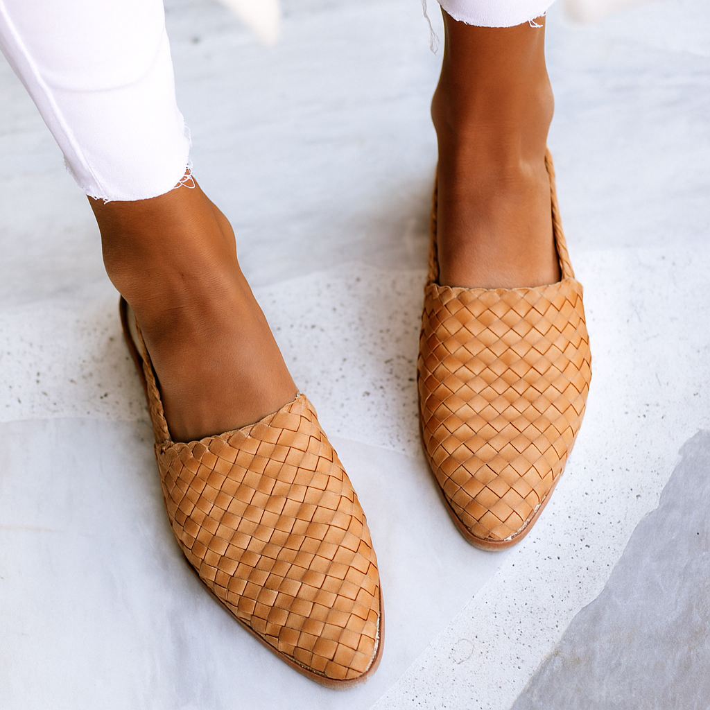 Women's woven slip-on mules, closed toe flat sandals for comfortable everyday style.