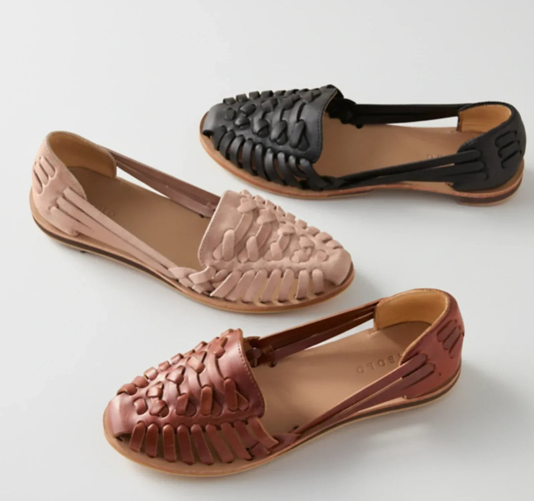 Comfortable women's slip-on mules featuring a woven design & orthopedic arch support for daily wear.