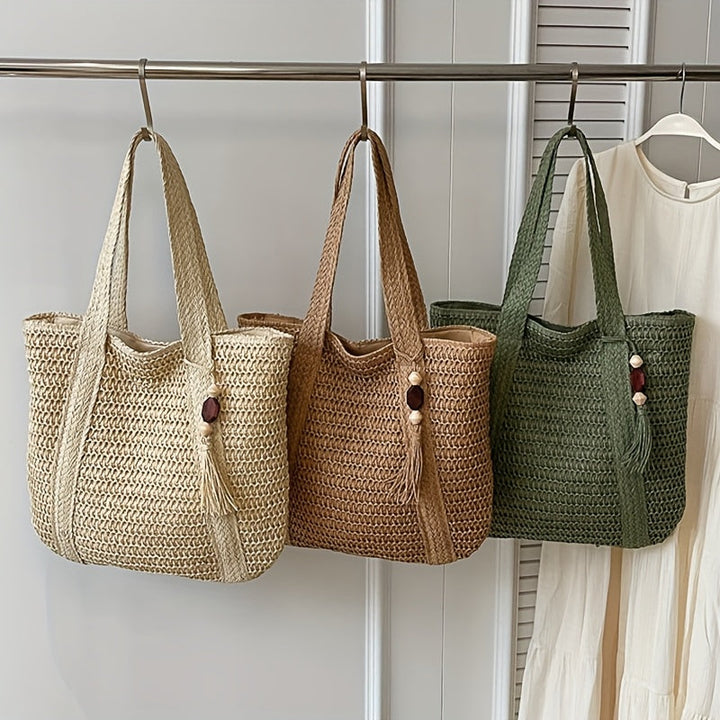 Large woven straw shoulder bag for women with attractive fringe & a trendy tassel. Summer essential.