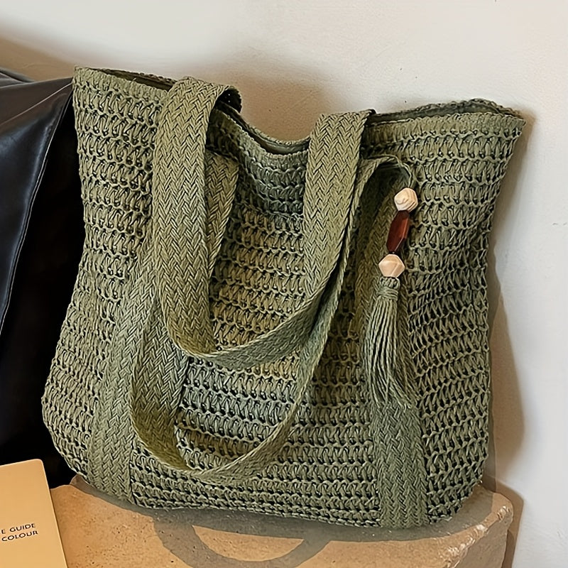 Boho-chic women's straw tote with dynamic fringe and a charming tassel. Perfect beach or holiday bag.