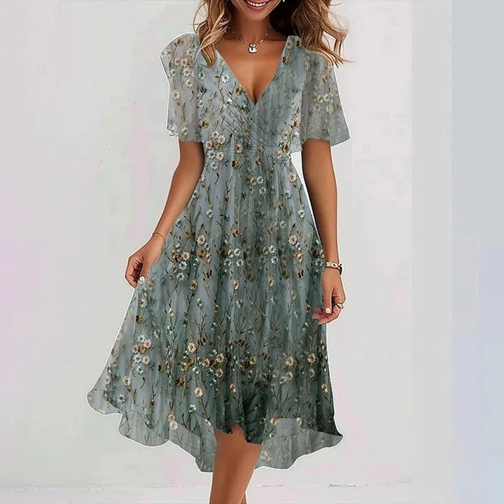 Casual yet elegant women's wrap V-neck midi dress with flutter sleeves & a comfortable fit.