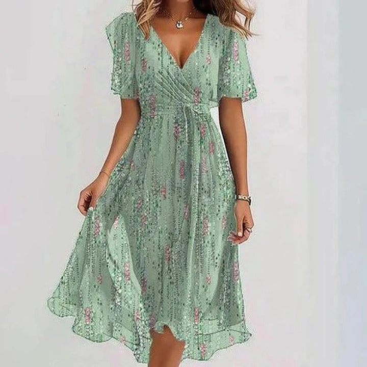 Elegant women's wrap V-neck flutter sleeve midi dress, featuring a flowing skirt for special occasions.