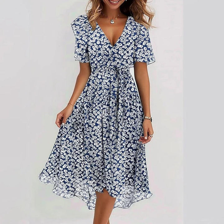 Feminine women's wrap midi dress with V-neck, graceful flutter sleeves, and stylish ruffle hem.