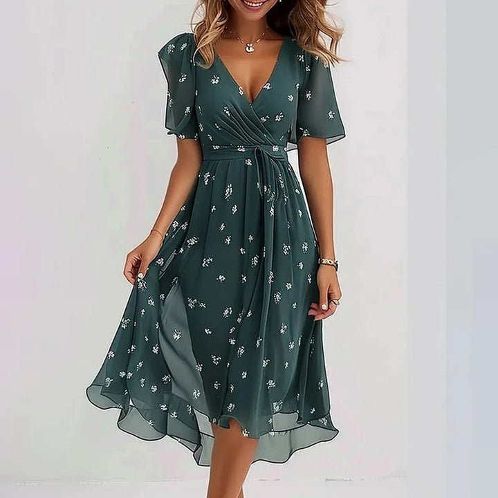 Lightweight summer women's wrap V-neck midi dress, offering comfort with elegant flutter sleeves.