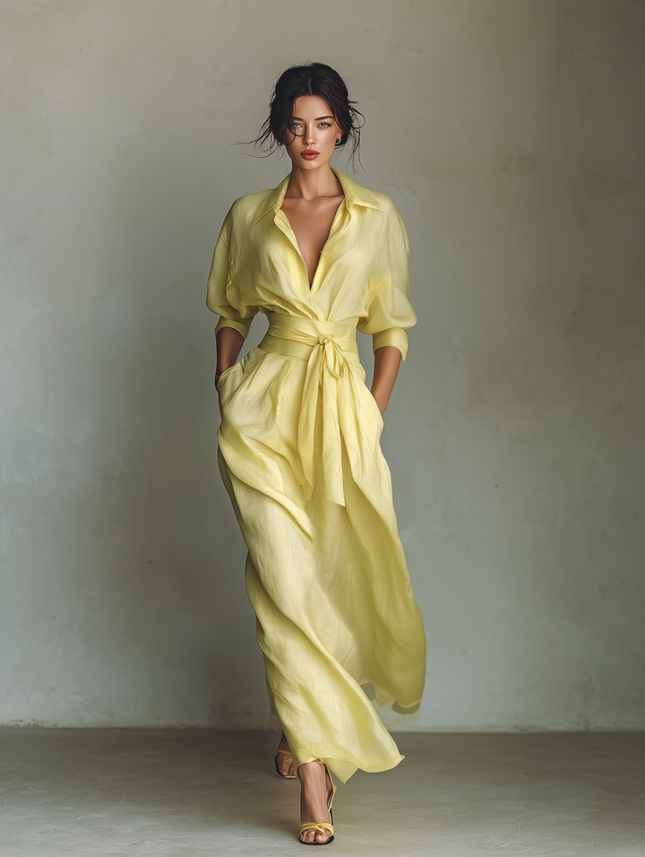 Yellow women's shirt dress with V-neck, long sleeves. Elegant yet casual maxi style, perfect for versatile summer outfits.