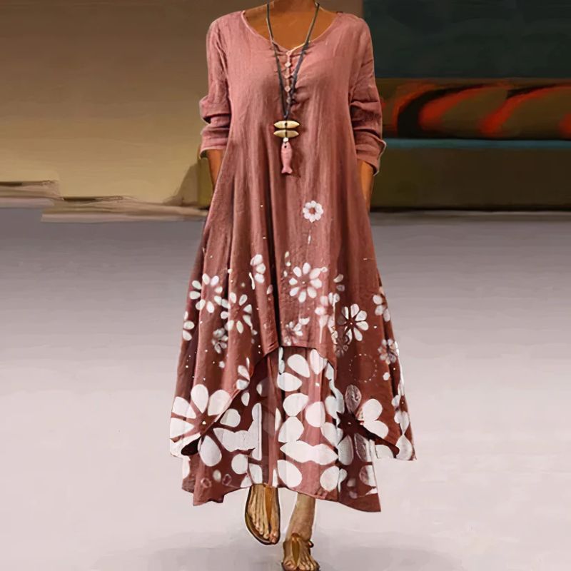 Women's boho maxi dress with long sleeves, layered hem, asymmetrical cut, and relaxed fit; ideal for spring outings.