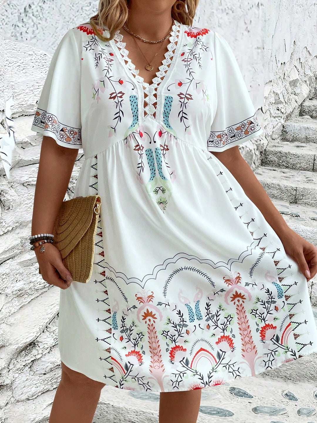 Women's plus size midi dress with boho lace, featuring intricate details and flowing silhouette, front view.
