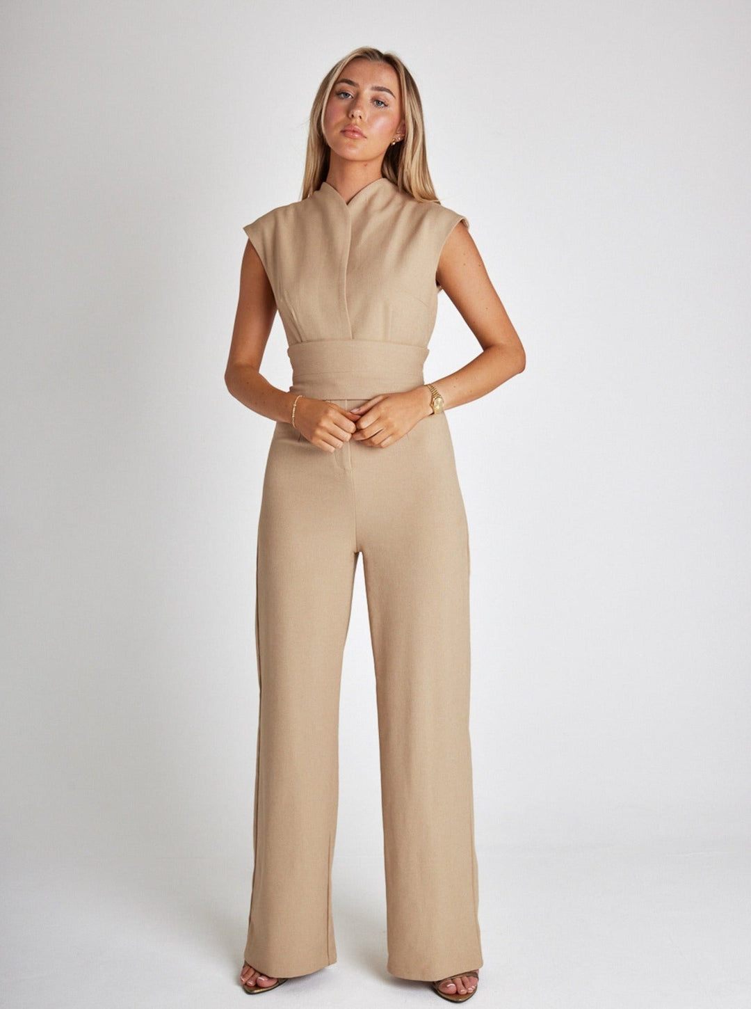 "Women's sleeveless belted jumpsuit with wide-leg, soft fabric, and detachable belt for stylish and comfortable wear."