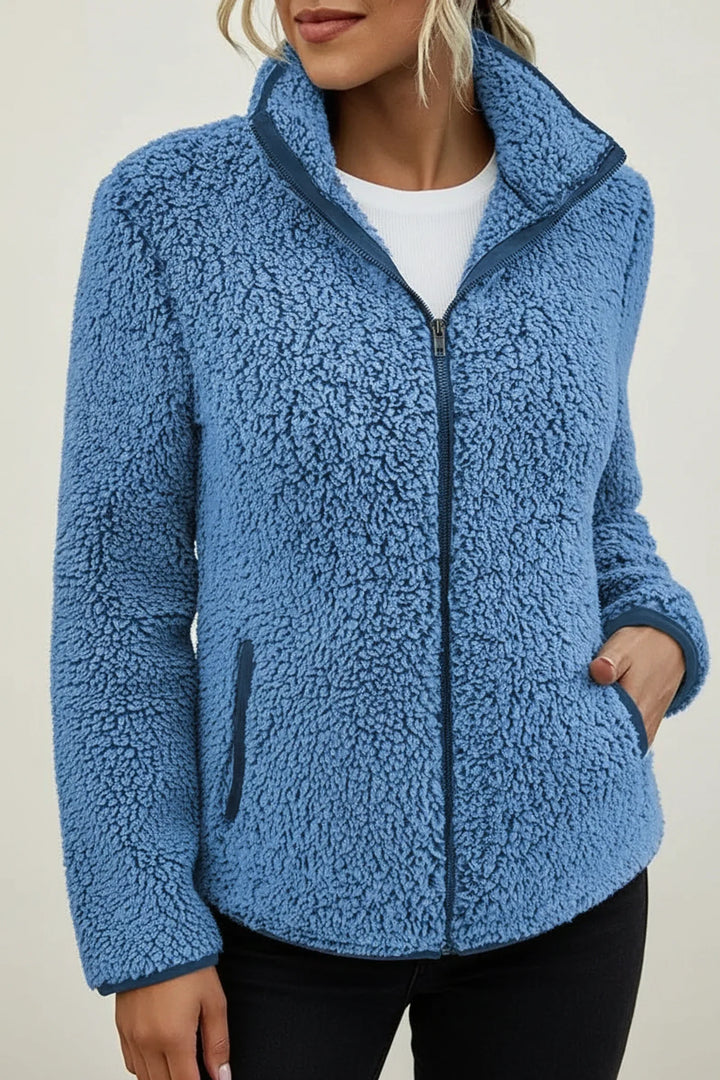 Effortlessly warm women's cozy plush winter jacket, a stylish zip-up coat with a stand collar for cold days.